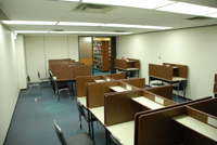 Old space with cubicles and dull dirty carpet