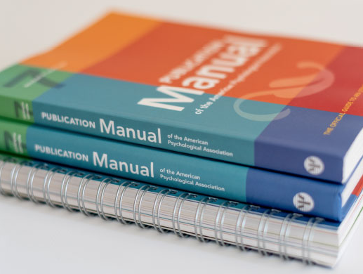 The print edition of the latest APA manual, with a brightly coloured cover.