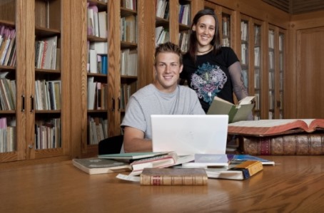 Students with books at table