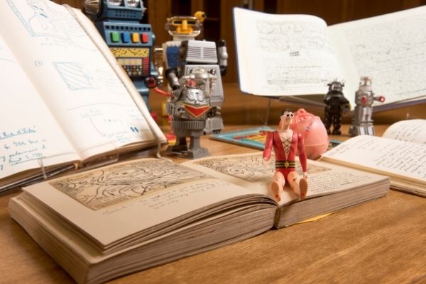 Books, personal papers, and action figures from the bpNichol fonds