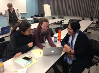 Students looking at a laptop