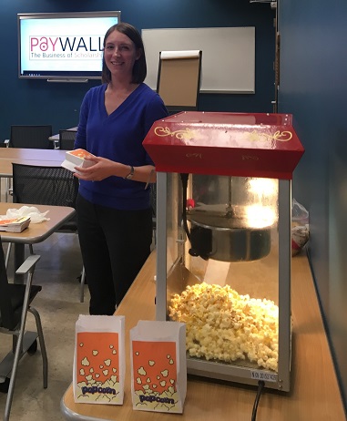 librarian standing by popcorn machine