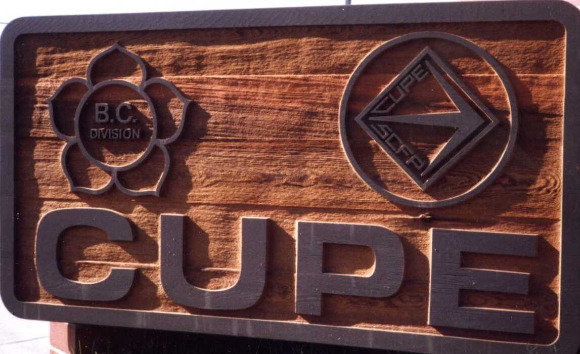 Carved wooden CUPE sign