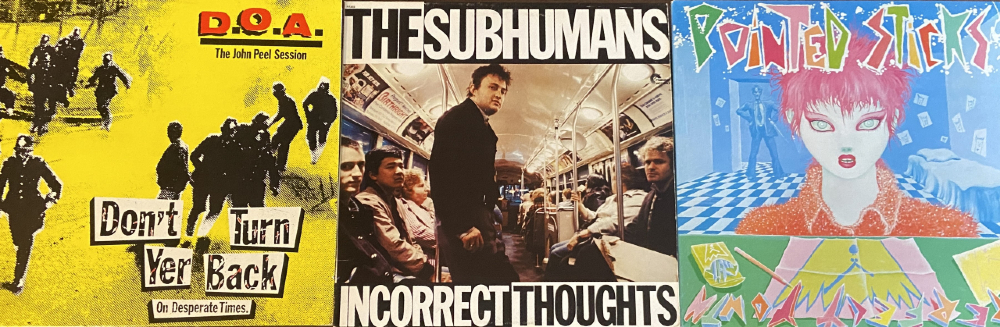 A set of three vinyl record covers sitting next to each other. First vinyl in yellow with red text, black text, and further black text with white accents: "D.O.A., The John Peel Session, Don't Turn Yer Back On Desperate Times." Second vinyl in black text with white background, white text with black background, riders on transit in centre: "The Subhumans, Incorrect Thoughts." Third vinyl in blue with green, pink, red, and orange accents: "Pointed Sticks, Perfect Youth."