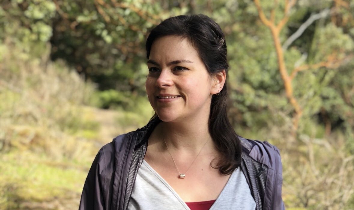 Portrait of a smiling woman standing outdoors