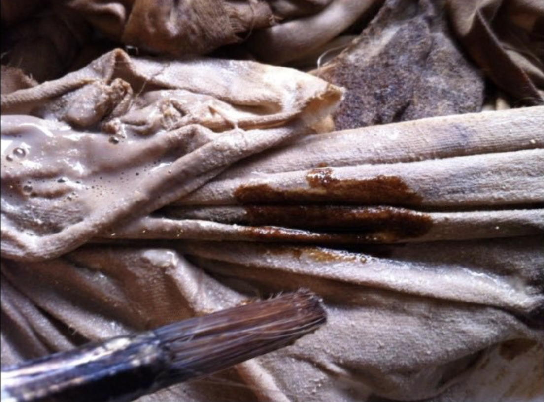 Artist's materials used to create the installation: brushes and heavy cotton fabric.