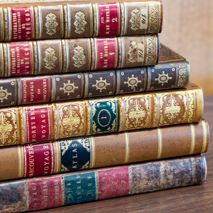 Books from the Anfield Collection stacked on top of each other