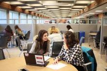 Ghezal and Mariam chatting in the SLC consultation space in the Bennett Library
